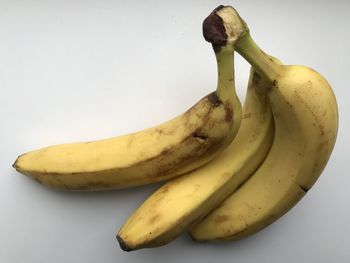 Close-up of bananas against white background