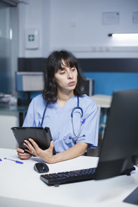 Businesswoman working at table