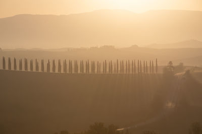 Scenic view of mountains against sky during sunset