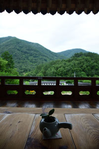 Table and chairs and tables against mountain range