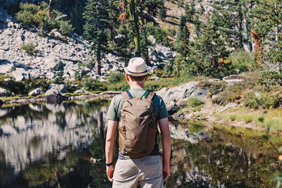 Rear view of man standing on mountain