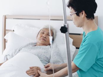 Nurse examining patient at hospital