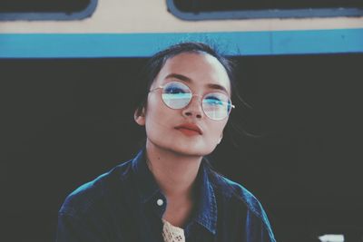 Portrait of young woman wearing sunglasses