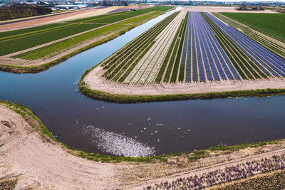 High angle view of land by lake