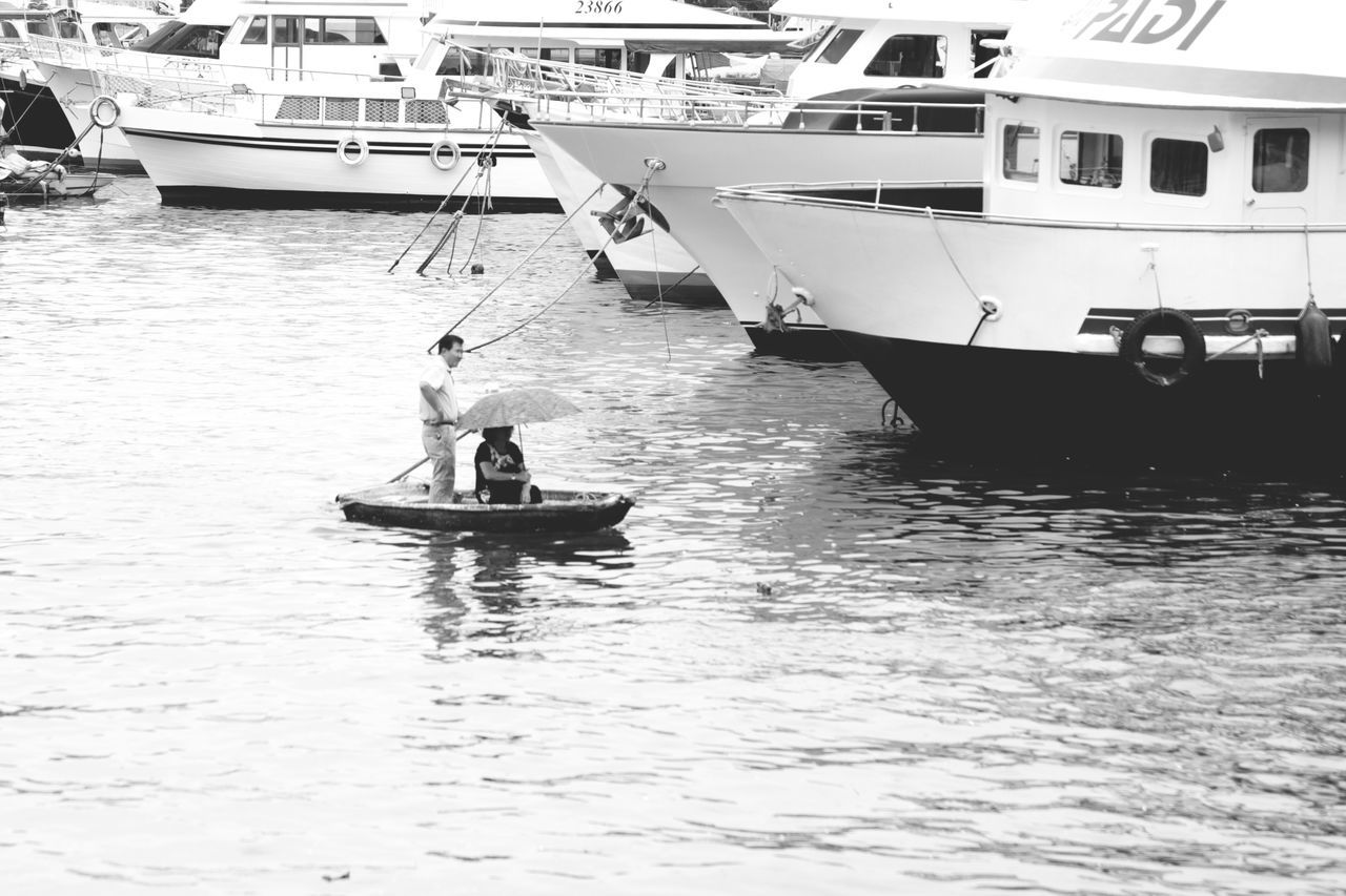 nautical vessel, transportation, mode of transportation, water, waterfront, sea, nature, travel, men, day, real people, sailing, two people, people, moored, outdoors, lifestyles, ship, sky, passenger craft