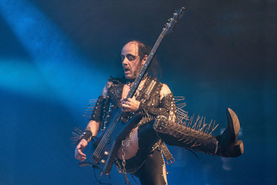 Man playing guitar at music concert