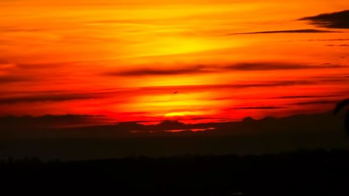 Scenic view of dramatic sky during sunset