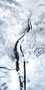 Shadow of person on snow covered mountain