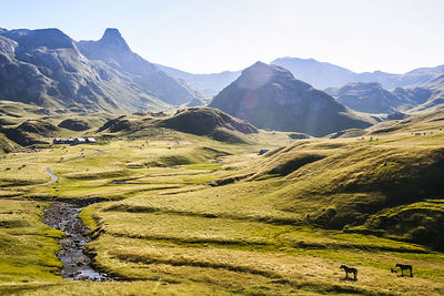 Scenic view of landscape and mountains against sky