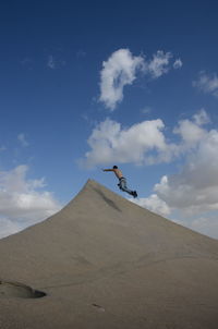 Man jumping on desert