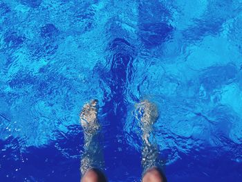 Personal perspective of feet in swimming pool