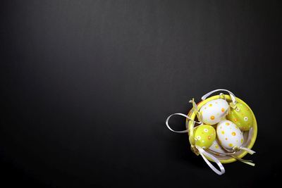 Directly above shot of candies on table against black background