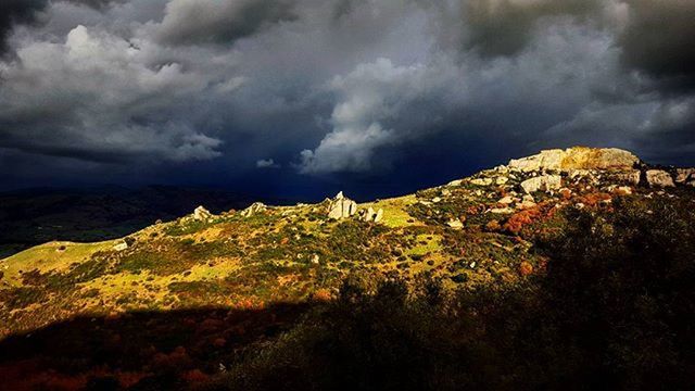 sky, mountain, cloud - sky, cloudy, tranquil scene, scenics, beauty in nature, tranquility, landscape, nature, cloud, weather, mountain range, overcast, idyllic, tree, non-urban scene, hill, storm cloud, outdoors