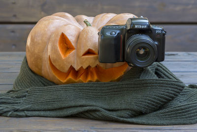 Close-up of camera on table