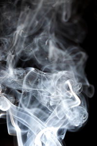 Close-up of smoke against black background