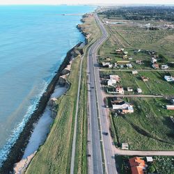 High angle view of road by sea against sky