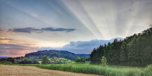 Scenic view of landscape against sky during sunset