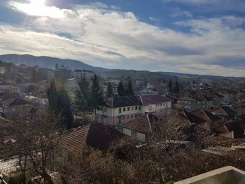 Houses in town against sky