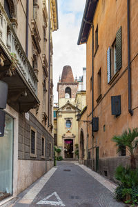 Narrow alley amidst buildings in city