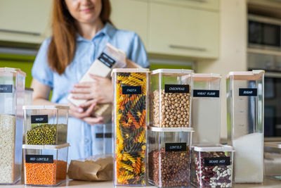 Woman standing in store for sale at market