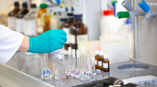 Cropped hand of scientist working in laboratory