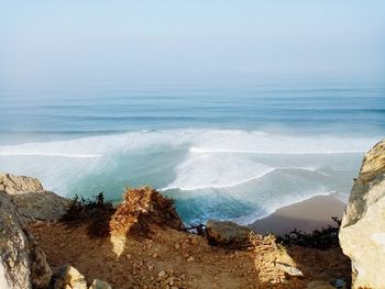 High angle view of sea shore against sky