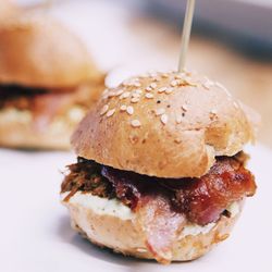 Close-up of hamburger served on table