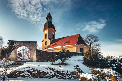 Building against sky during winter