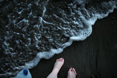 Low section of woman at beach