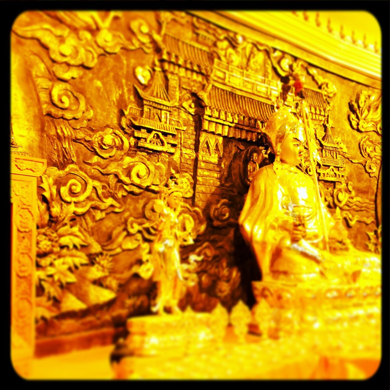 transfer print, indoors, auto post production filter, art and craft, art, yellow, creativity, close-up, human representation, statue, carving - craft product, sculpture, no people, gold colored, ornate, religion, detail, selective focus, spirituality