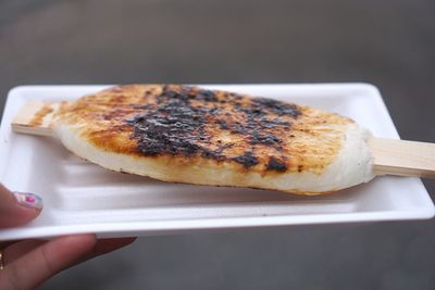 Close-up of hand holding sandwich