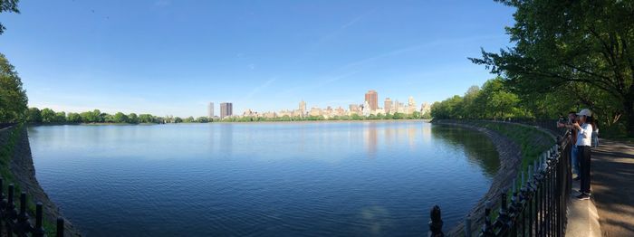 Scenic view of river against blue sky