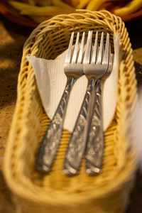 Close-up of fork on wicker basket