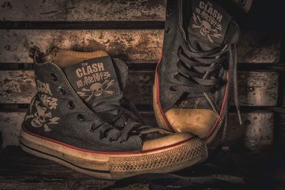 Close-up of shoes on wall