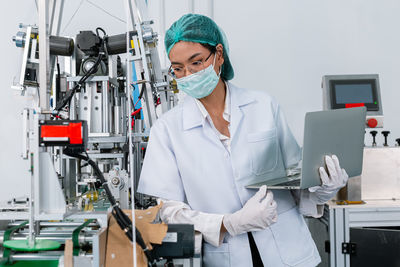 Doctor wearing mask working in laboratory