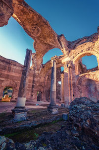 View of old ruins against blue sky