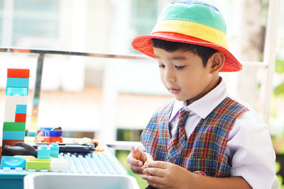 Portrait of cute boy looking away