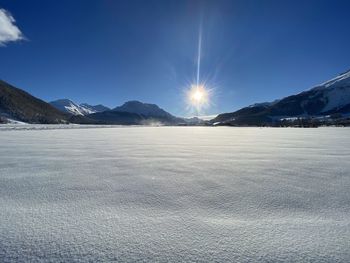 Scenic view of snowcapped mountains against sky