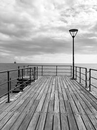 Pier over sea against sky