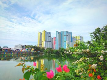 Scenic view of sea and buildings against sky