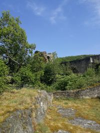 Scenic view of waterfall against sky