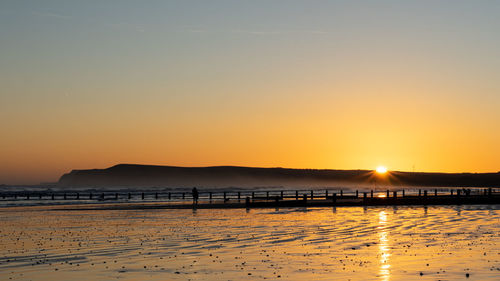 Scenic view of sea against sky during sunset