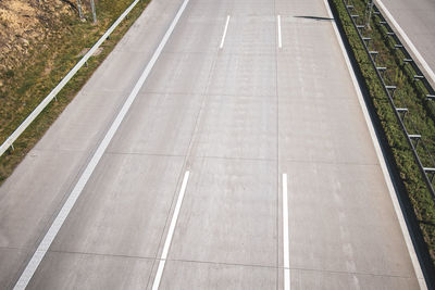 High angle view of arrow symbol on road in city