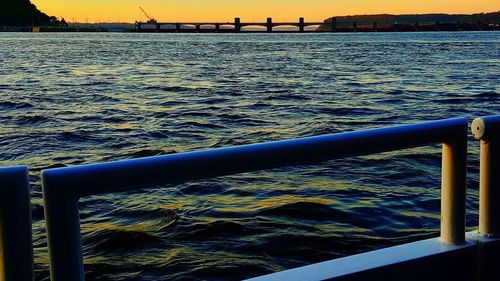 Close-up of railing by sea