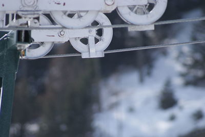 Close-up of machinery on snow