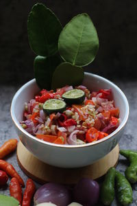 High angle view of chopped fruits in bowl on table