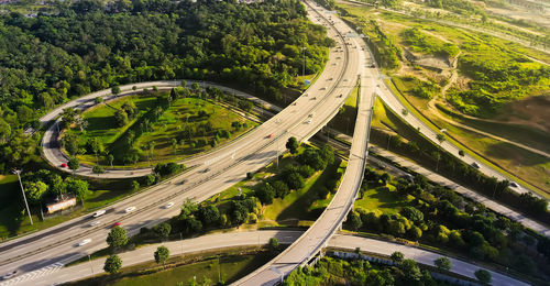 High angle view of highway amidst trees in city