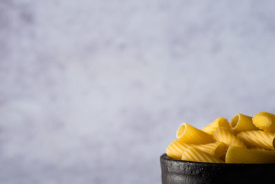 Close-up of yellow cake against white background
