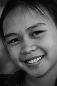 Close-up portrait of smiling girl