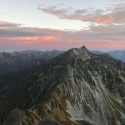 Scenic view of mountains against sky during sunset